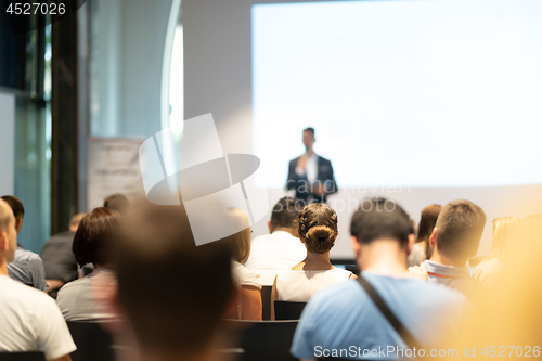 Image of Male business speaker giving a talk at business conference event.