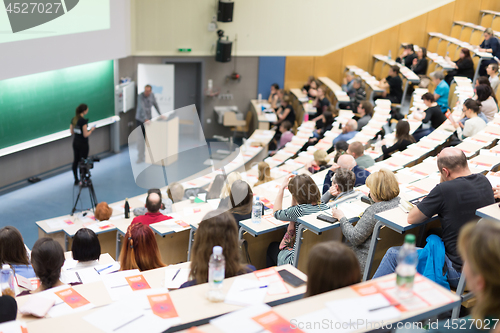 Image of Expert speaker giving a talk at scientific business conference event.