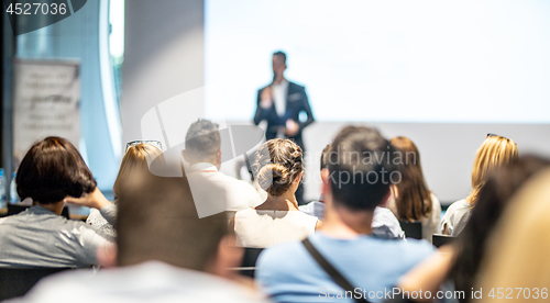 Image of Male business speaker giving a talk at business conference event.