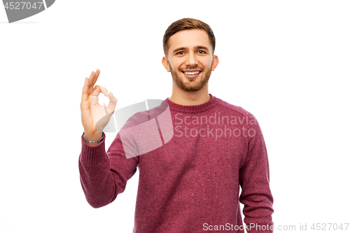 Image of smiling young man over white background
