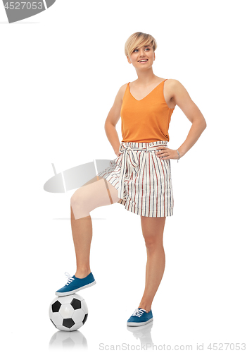 Image of smiling teenage girl with soccer ball