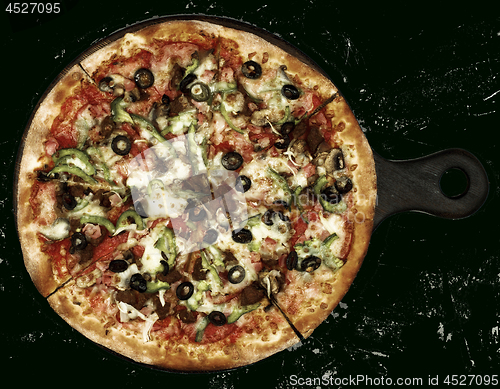 Image of Delicious Pizza with Ham, Olives and Jalapenos