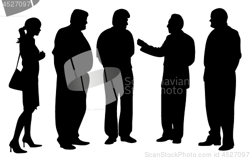 Image of Group of business people at a meeting talking