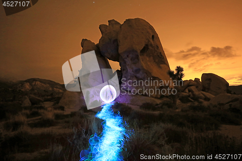 Image of Person Light Painted in the Desert Under the Night Sky