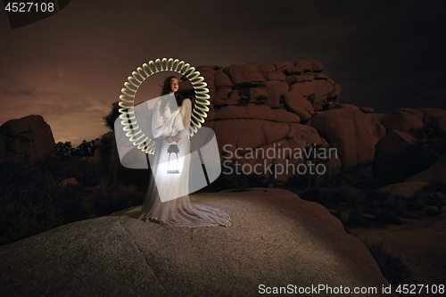 Image of Person Light Painted in the Desert Under the Night Sky