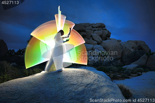 Image of Person Light Painted in the Desert Under the Night Sky