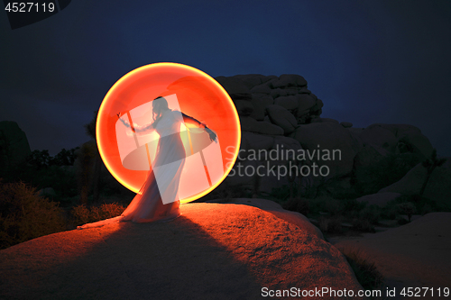 Image of Person Light Painted in the Desert Under the Night Sky