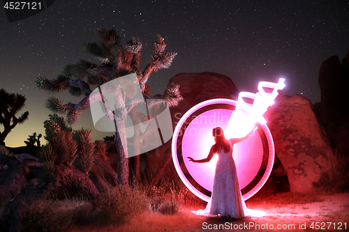 Image of Person Light Painted in the Desert Under the Night Sky