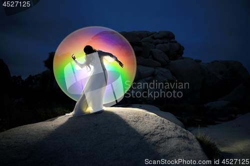 Image of Person Light Painted in the Desert Under the Night Sky