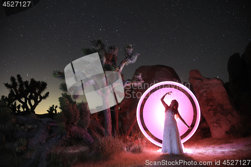 Image of Person Light Painted in the Desert Under the Night Sky