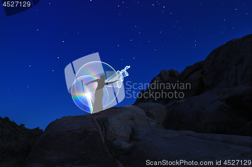 Image of Person Light Painted in the Desert Under the Night Sky