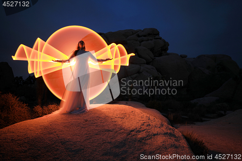 Image of Person Light Painted in the Desert Under the Night Sky