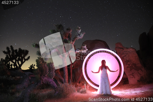 Image of Person Light Painted in the Desert Under the Night Sky