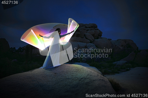 Image of Person Light Painted in the Desert Under the Night Sky