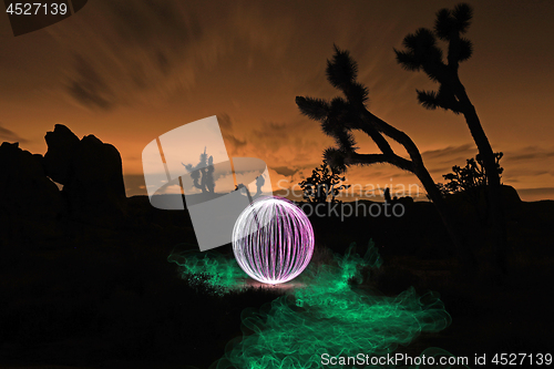 Image of Person Light Painted in the Desert Under the Night Sky