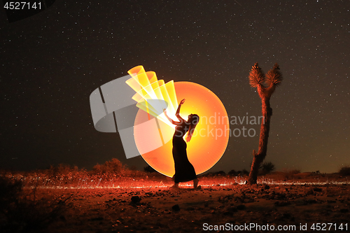 Image of Person Light Painted in the Desert Under the Night Sky