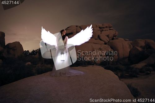 Image of Person Light Painted in the Desert Under the Night Sky