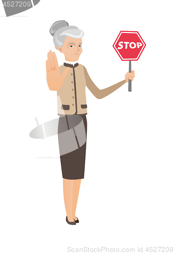 Image of Caucasian business woman holding stop road sign.