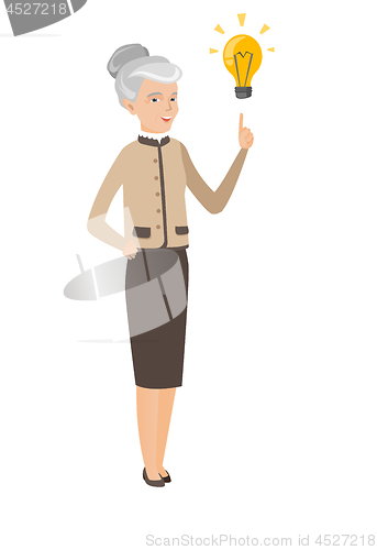 Image of Caucasian business woman pointing at idea bulb.