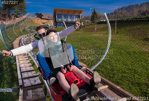 Image of couple driving on alpine coaster