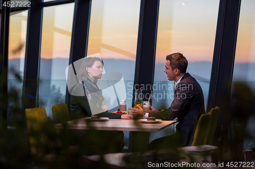 Image of loving couple enjoying romantic dinner