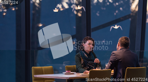 Image of loving couple enjoying romantic dinner