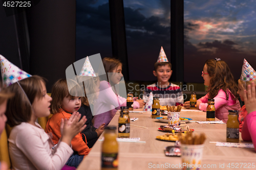 Image of young boy having birthday party