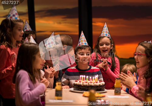 Image of young boy having birthday party