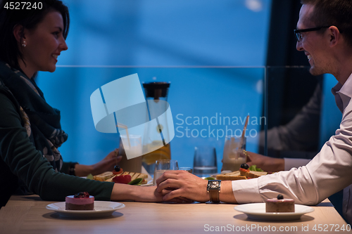 Image of loving couple enjoying romantic dinner