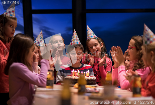 Image of young boy having birthday party