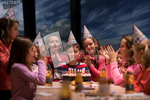 Image of young boy having birthday party