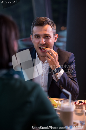 Image of loving couple enjoying romantic dinner