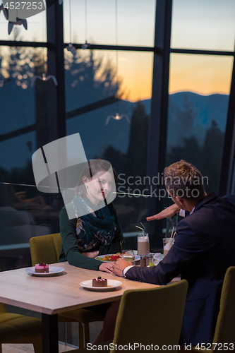 Image of loving couple enjoying romantic dinner