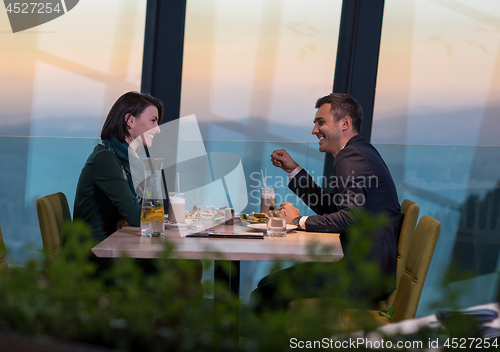 Image of loving couple enjoying romantic dinner