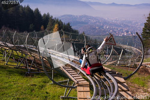 Image of couple driving on alpine coaster