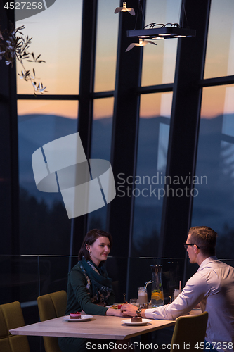 Image of loving couple enjoying romantic dinner