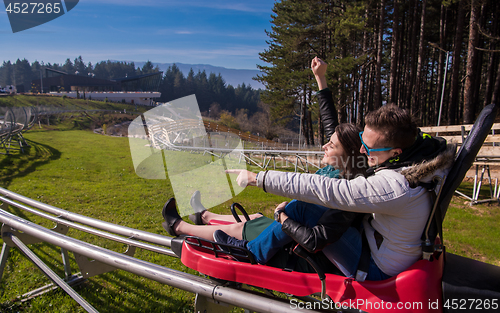 Image of couple driving on alpine coaster