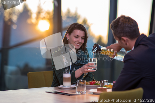 Image of loving couple enjoying romantic dinner