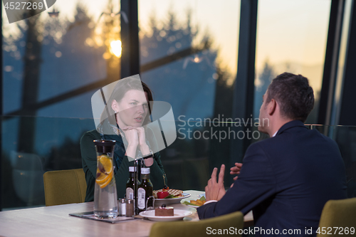 Image of loving couple enjoying romantic dinner