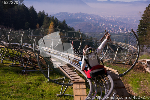 Image of couple driving on alpine coaster