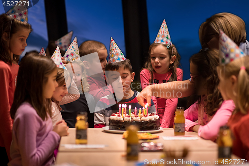 Image of young boy having birthday party