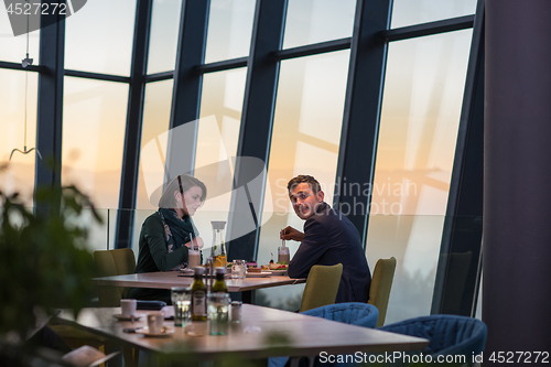 Image of loving couple enjoying romantic dinner