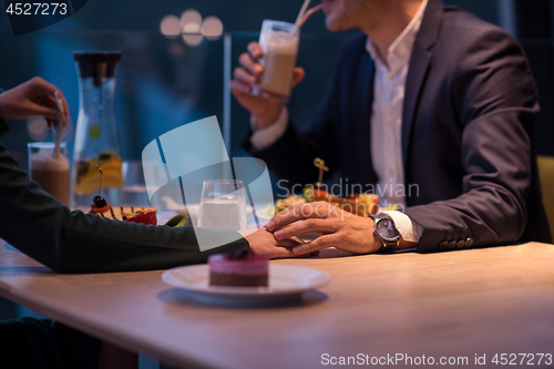 Image of loving couple enjoying romantic dinner