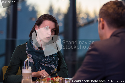 Image of loving couple enjoying romantic dinner