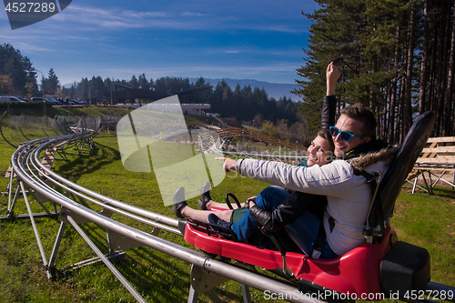 Image of couple driving on alpine coaster