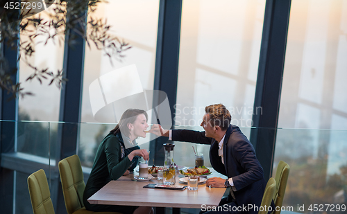 Image of loving couple enjoying romantic dinner