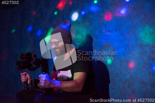 Image of videographer in neon disco party