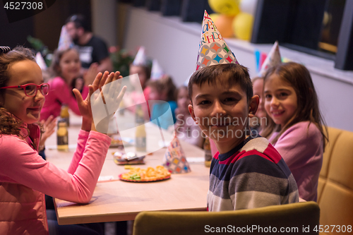 Image of The young boy joyfully celebrating his birthday