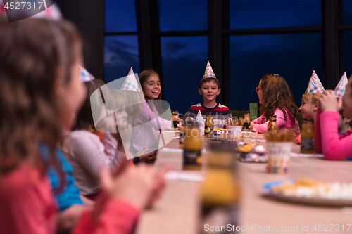 Image of young boy having birthday party