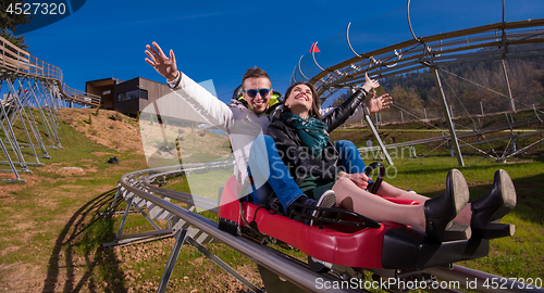 Image of couple driving on alpine coaster